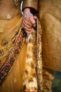 Indian Bride and Groom holding hands